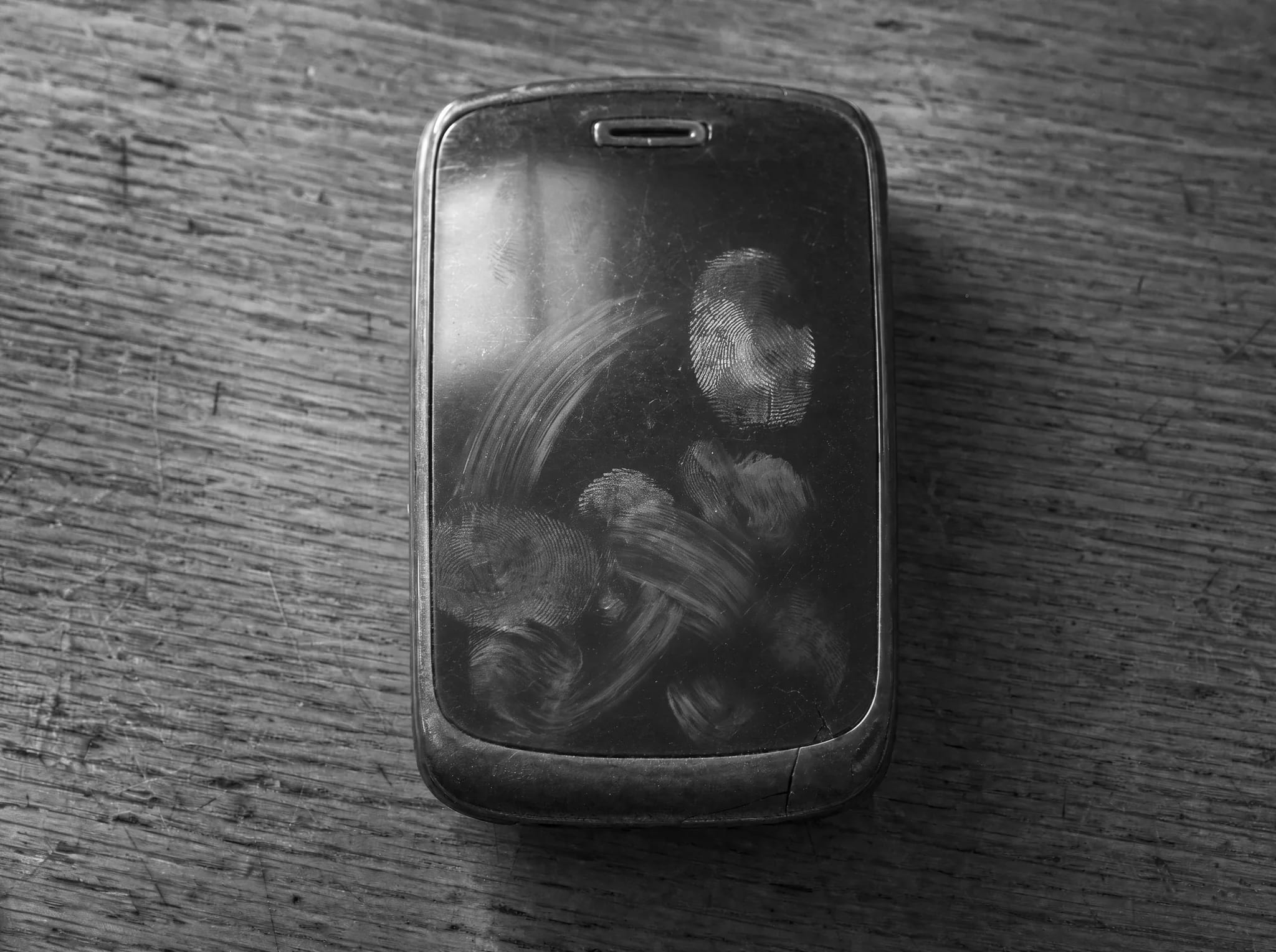 The glass covered in a day of thumbprints